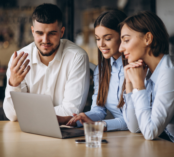 group-of-people-working-out-business-plan-in-an-office 1